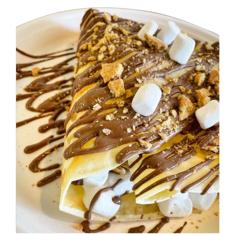 A crepe covered with chocolate graham crackers marshmallows on a plate.